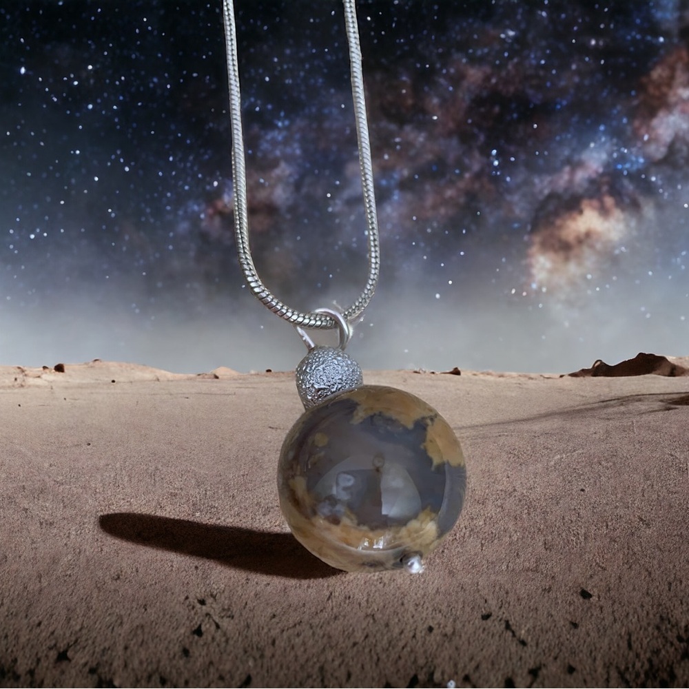 Extremely unique one of a kind earth and moon pendant.